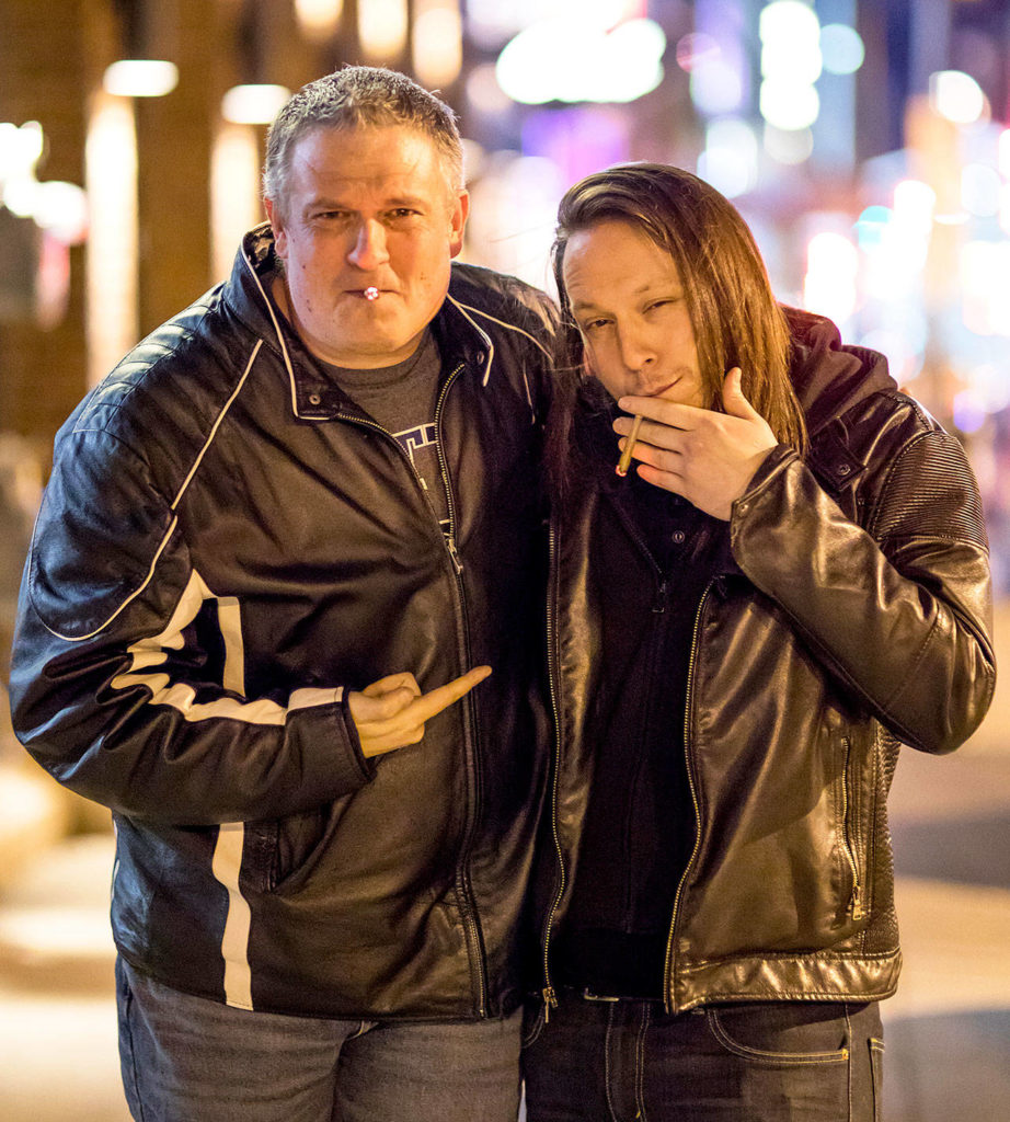 Comedians Jason Stewart (left) and Tyler Smith, the founder of The Dope Show, smoke weed before going on stage to perform stand-up comedy. (Casey Bebernes)
