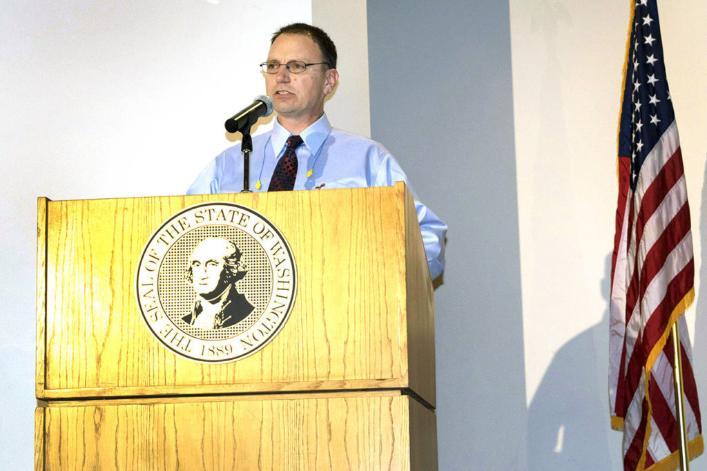 Ken Buretta speaks at a Worker Memorial ceremony April 4 in Olympia. (WSDOT photo)
