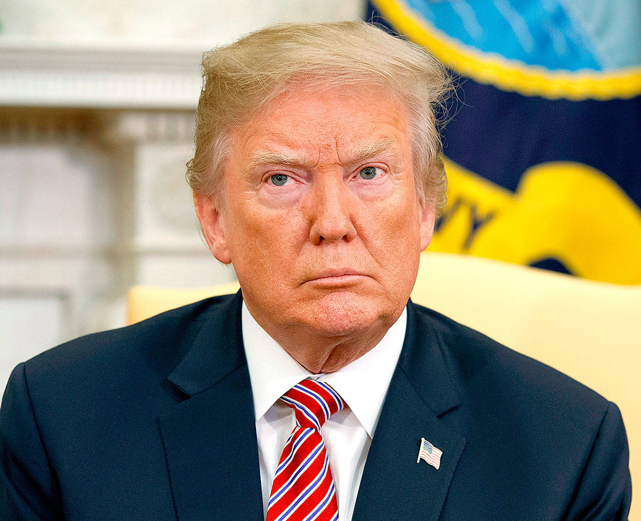 President Donald Trump listens during a meeting in the Oval Office of the White House in Washington on Tuesday. (AP Photo/Evan Vucci, File)