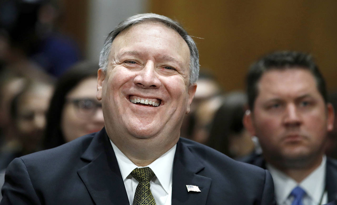 CIA Director Mike Pompeo, picked to be the next secretary of state, laughs at a joke while he is introduced before the Senate Foreign Relations Committee during a confirmation hearing on his nomination to be Secretary of State on Thursday on Capitol Hill in Washington. (AP Photo/Jacquelyn Martin)