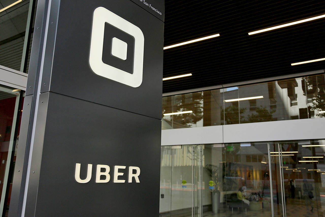 Uber will start doing annual criminal background checks on U.S. drivers and hire a company that constantly monitors criminal arrests as it tries to do a better job of keeping riders safe, the company announced Thursday. (AP Photo/Eric Risberg, File)