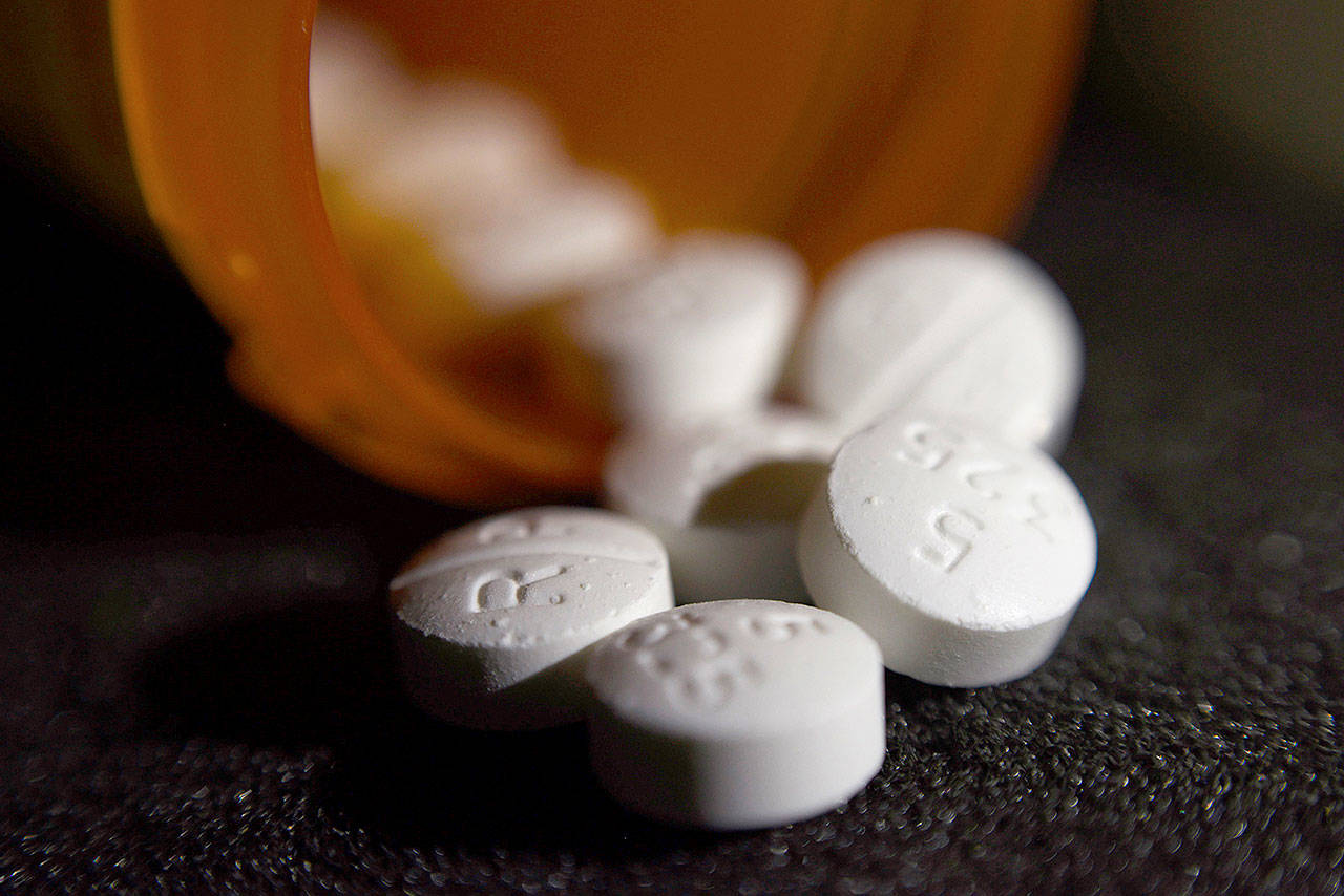 Pills of the opioid oxycodone-acetaminophen. (AP Photo/Patrick Sison)