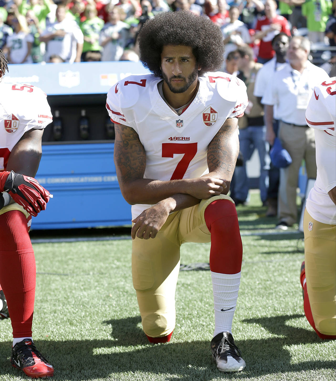 In this Sept. 25, 2016 photo, San Francisco 49ers’ Colin Kaepernick kneels during the national anthem before an NFL football game against the Seattle Seahawks, in Seattle. (AP Photo/Ted S. Warren, File)