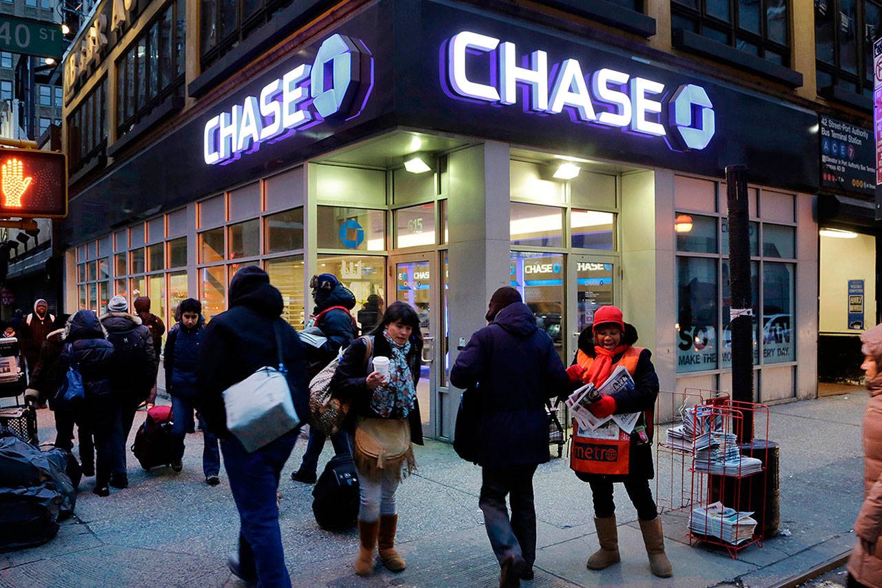 People walk past a branch of Chase bank on Jan. 14 2015 in New York. (Mark Lennihan / AP Photo)