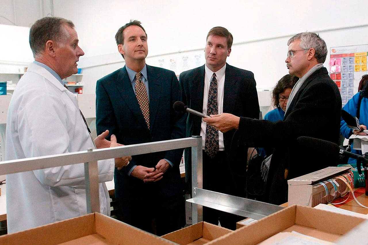 CanadaDrugs.com Director of Pharmacy Robert Fraser, left, takes Minnesota Gov. Tim Pawlenty, second left, on a tour of the Internet pharmacy CanadaDrugs.com in Winnipeg, Manitoba on Nov. 12, 2003. (Ruth Bonneville / AP Photo)