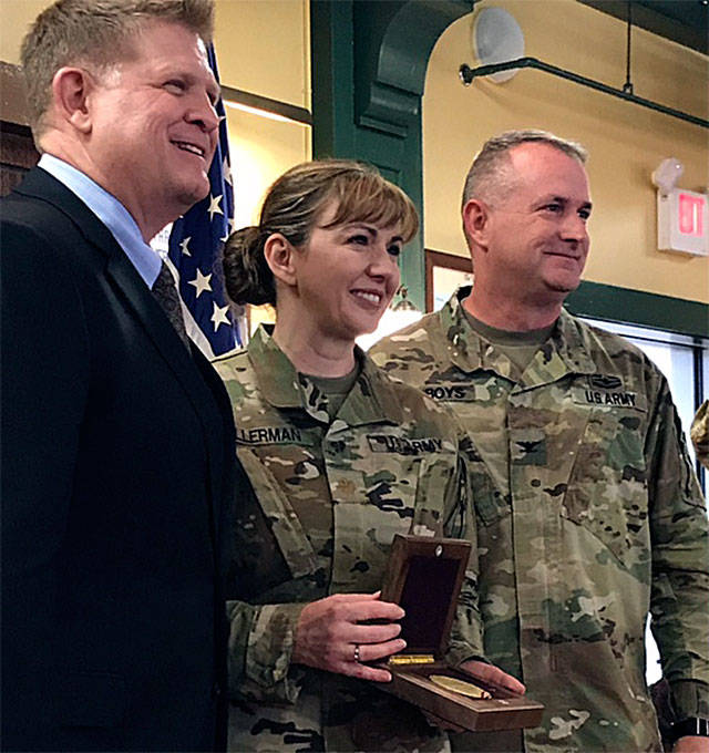 Diana Ellerman (center), social studies teacher at Cedarcrest Middle School, was recently honored by the U.S. Army Command and General Staff College at Joint Base Lewis­ McChord with the Pershing Award. (Contributed photo)