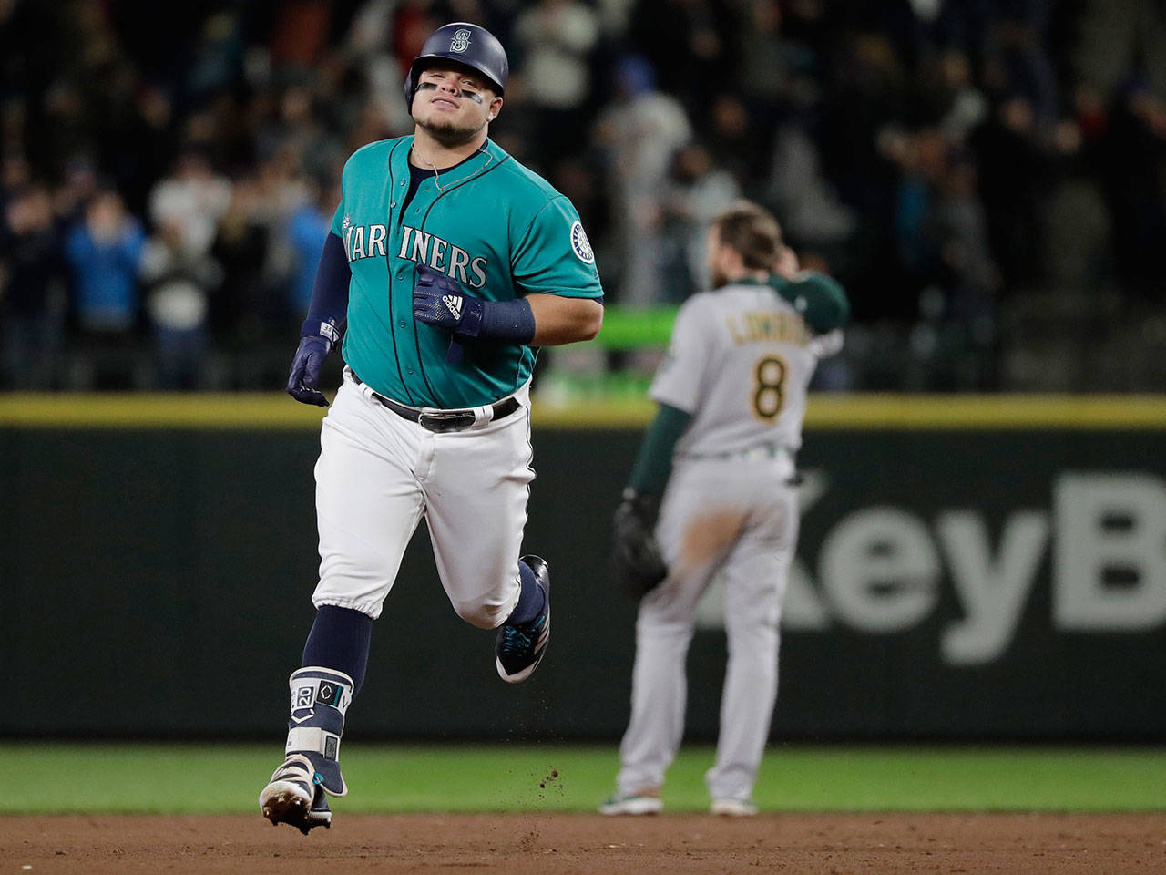 Seattle’s Daniel Vogelbach rounds the bases after hitting a two-run home run Friday at Safeco Field. (Ted S. Warren / Associated Press)