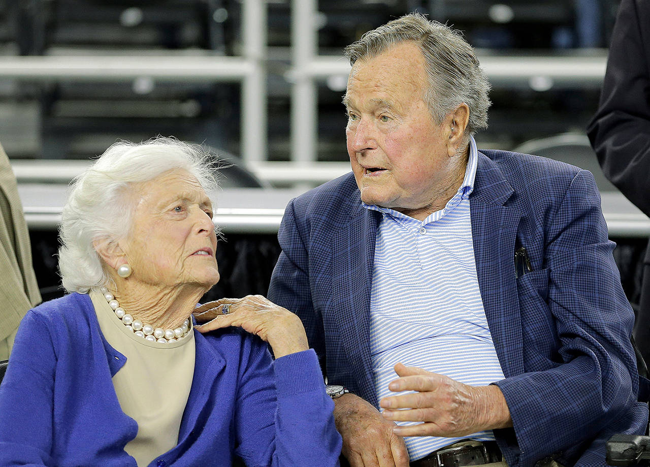 In this March 2015 photo, former President George H.W. Bush and his wife Barbara Bush speak before a college basketball regional final game between Gonzaga and Duke, in the NCAA basketball tournament in Houston. A family spokesman said Sunday that the former first lady Barbara Bush is in “failing health” and won’t seek additional medical treatment. (AP Photo/David J. Phillip, File)
