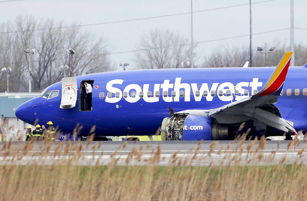 A Southwest Airlines plane sits on the runway at the Philadelphia International Airport after it made an emergency landing in Philadelphia on Tuesday. (David Maialetti /The Philadelphia Inquirer via AP)
