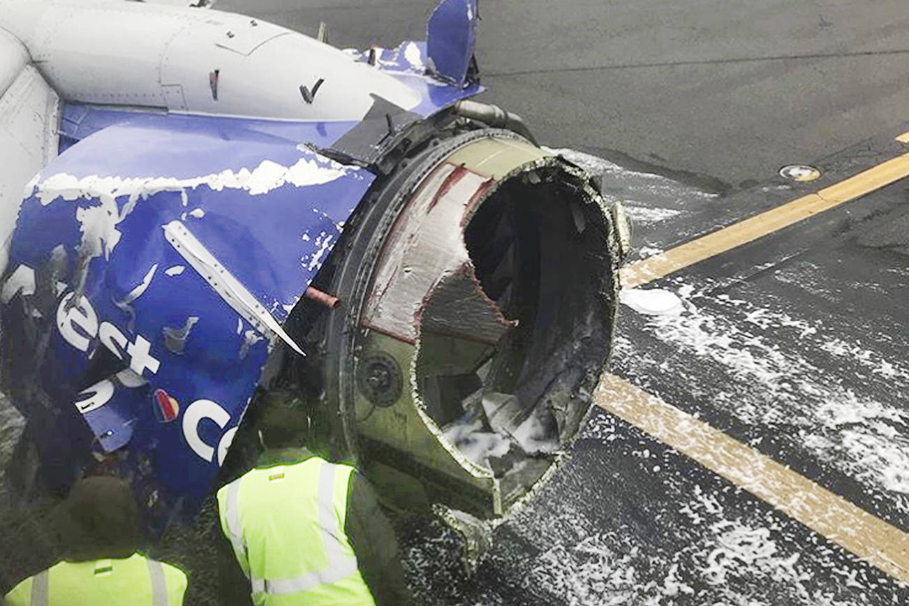 1 dead after 737 blows an engine; woman nearly sucked out
