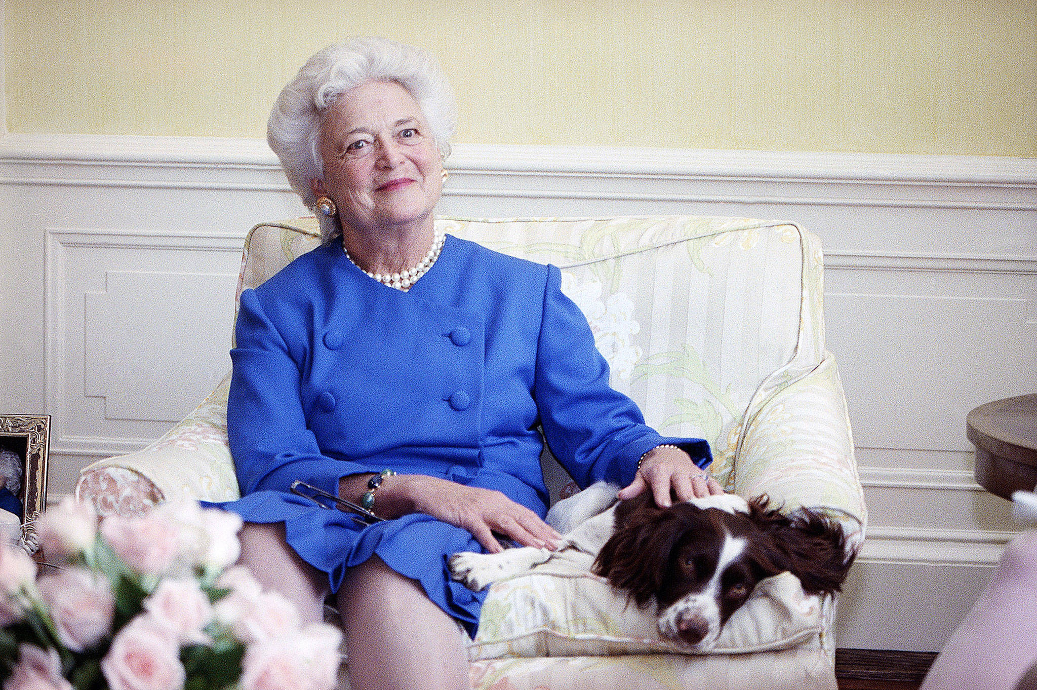 First lady Barbara Bush poses with her dog, Millie, in Washington in 1990. (Doug Mills / Associated Press)