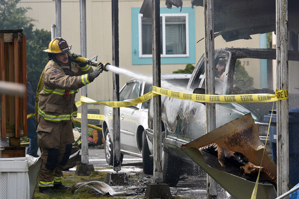 A fire left one man dead Wednesday at the Crystal Tree Village mobile home park. (Caleb Hutton / The Herald)
