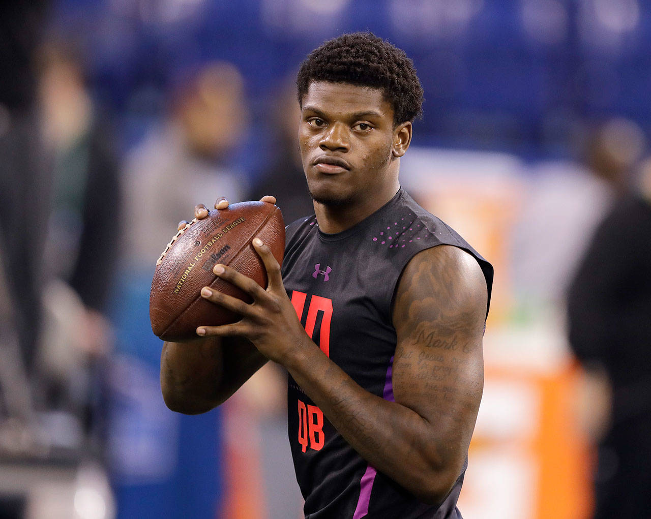 Louisville quarterback Lamar Jackson throws during a drill at the NFL scouting combine March 3 in Indianapolis. (AP Photo/Darron Cummings)