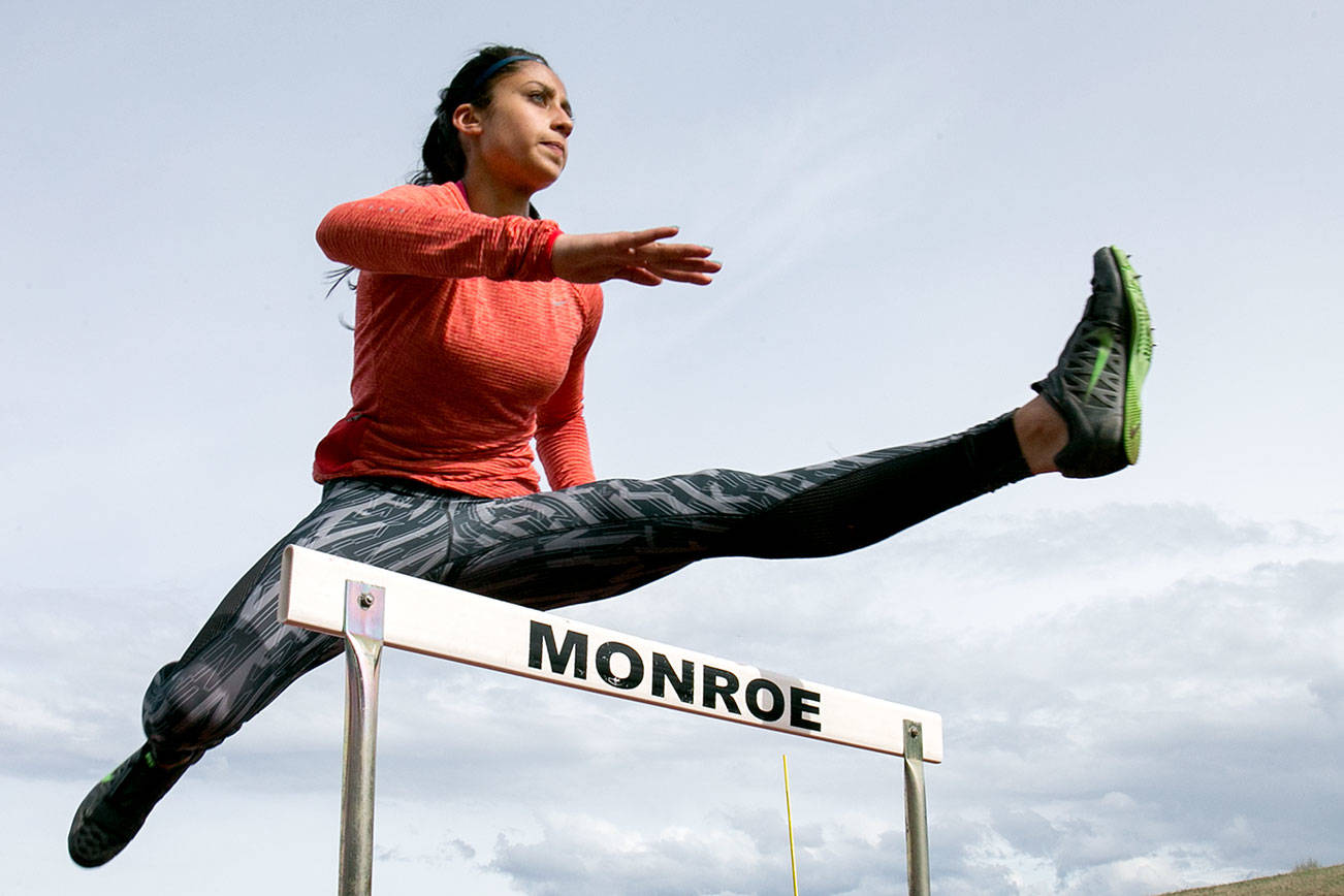 Hannah Ganashamoorthy practices on the hurdles Wednesday afternoon at Monroe High School in Monroe on April 18, 2018. (Kevin Clark / The Daily Herald)