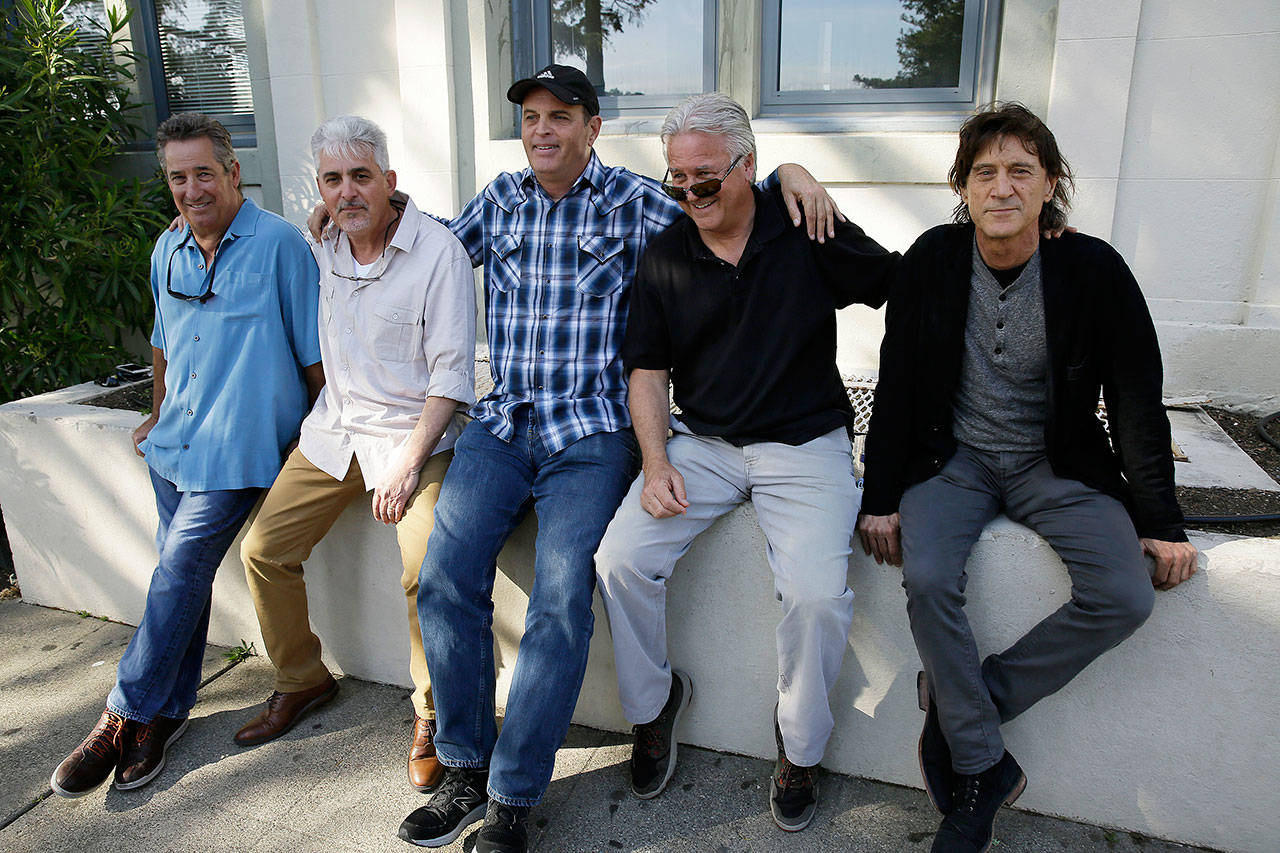 The Waldos (from left) Mark Gravitch, Larry Schwartz, Dave Reddix, Jeffrey Noel and Steve Capper sit on a wall they used to frequent at San Rafael High School in San Rafael, California. The five Northern California high school stoner buddies widely credited with creating the shorthand slang for getting high, 420, now serve as the day’s unofficial grand masters. (Eric Risberg / Associated Press)