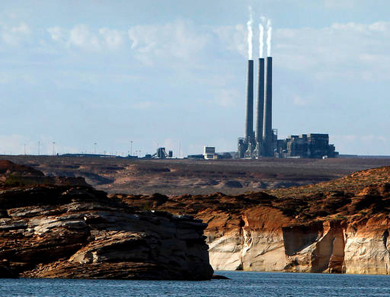 In this2011 photo, smoke rises from the stacks of a coal plant in Page, Arizona. (AP Photo/Ross D. Franklin, File)