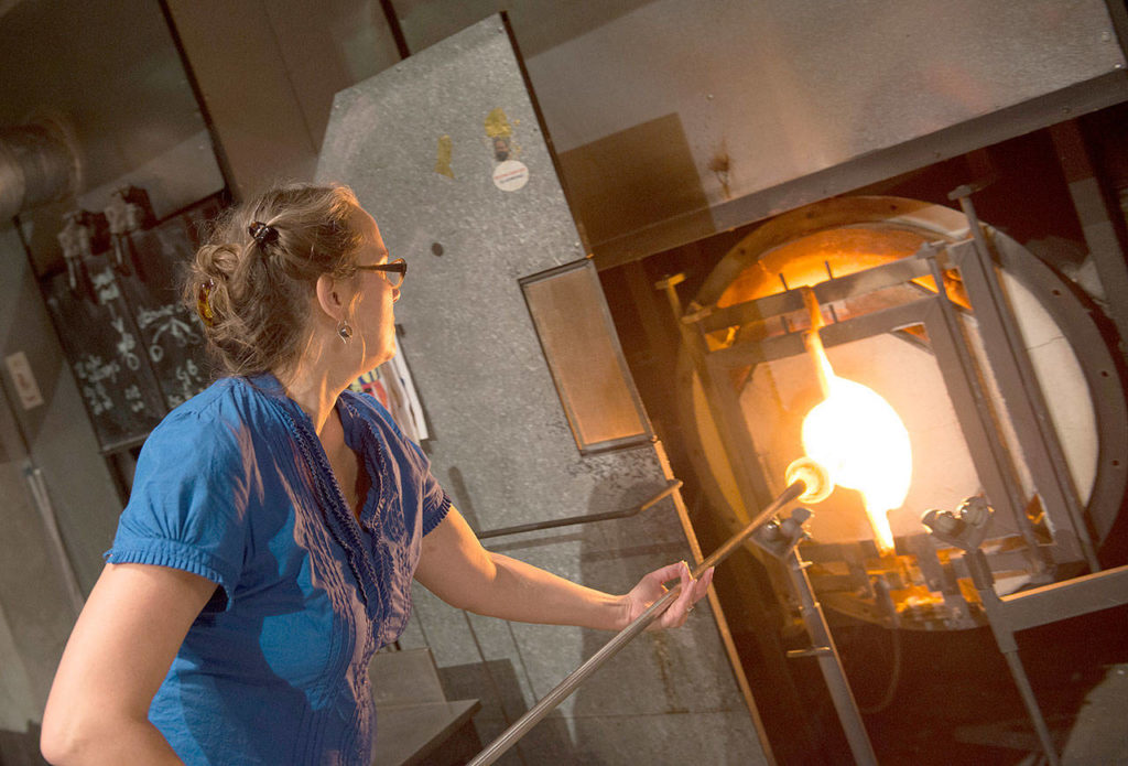 Kait Rhoads, the other artist at work, will be creating glass bull kelp for the Bainbridge Island Museum of Art during tours. (Photo by Rozarii Lynch)
