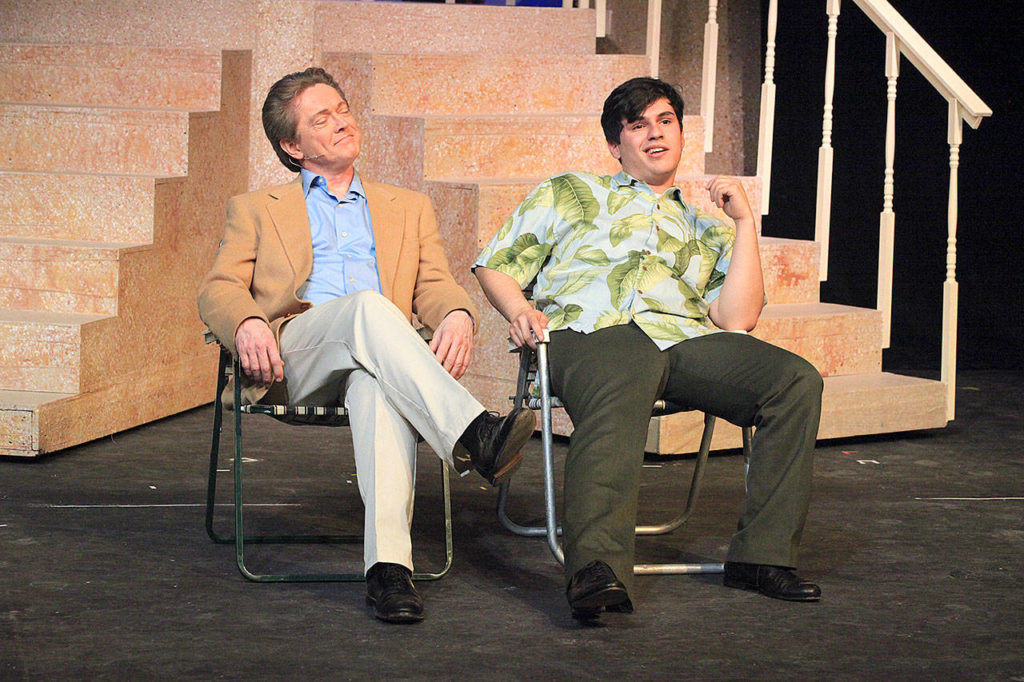 Lawrence (Jay Vilhauer), left, and Freddy (Gabriel Ponce) swap swindle stories in “Dirty Rotten Scoundrels.” (Edmonds Driftwood Players)
