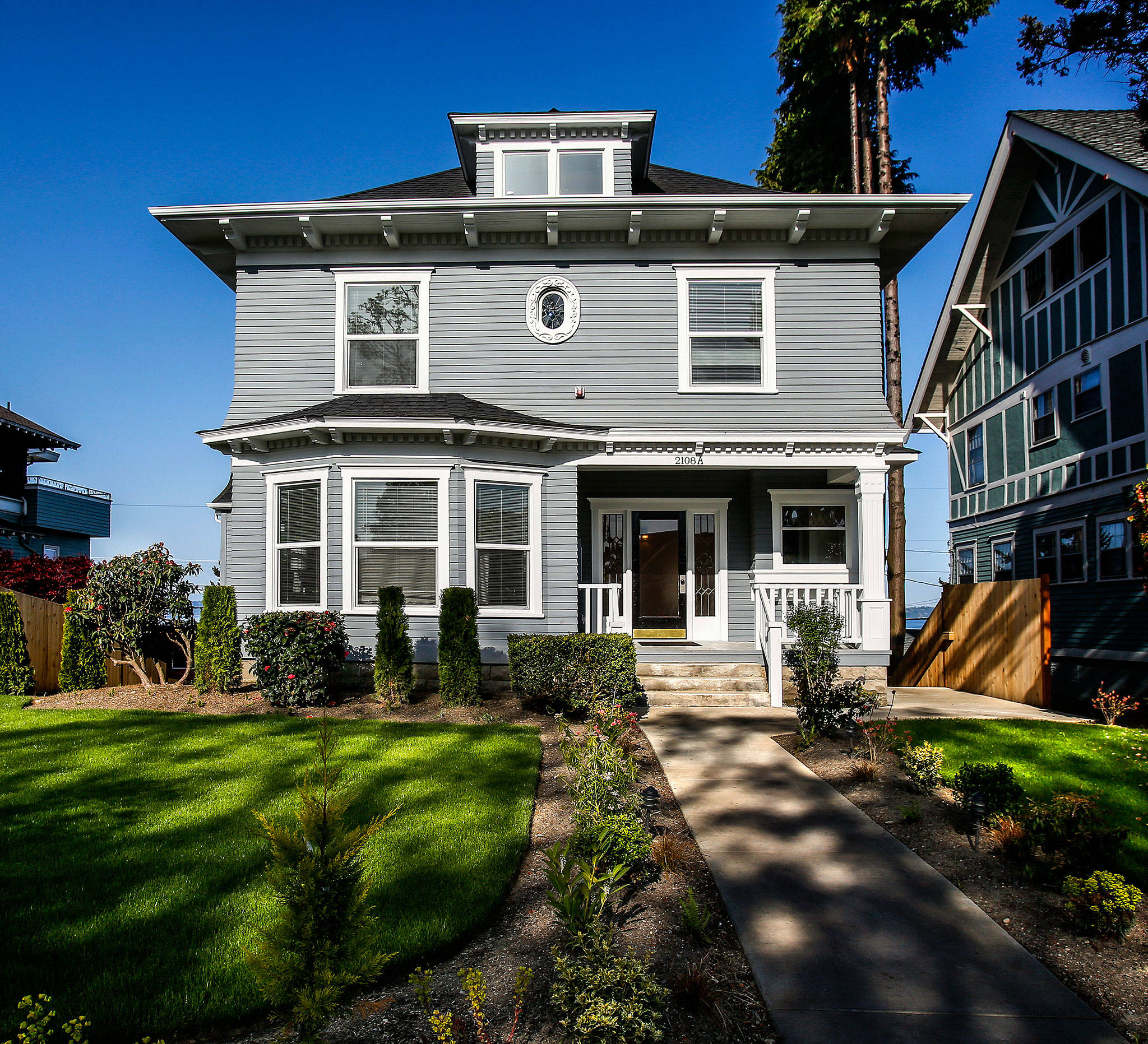 A 1907 beauty of a house at 2108 Rucker Ave. in Everett has been restored and renovated into six apartments after sitting empty and in disrepair for 15 years. Its owners now seek listing on the Everett Register of Historic Places.The house is next to the one Everett’s Bill Belshaw renovated in 2012. (Dan Bates / The Herald)