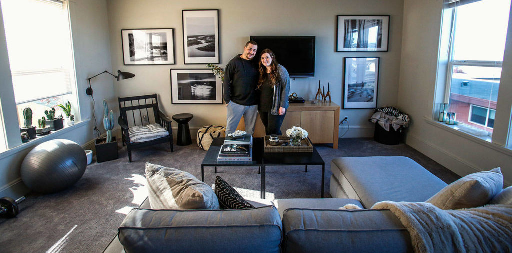 Brennan Pruitt, 26, and his wife, Jordyn Pruitt, 24, love their new apartment in Gary Nelson’s restoration of a 1907 house at 2108 Rucker Ave. that had been sitting empty and in disrepair for more than a decade. (Dan Bates / The Herald)
