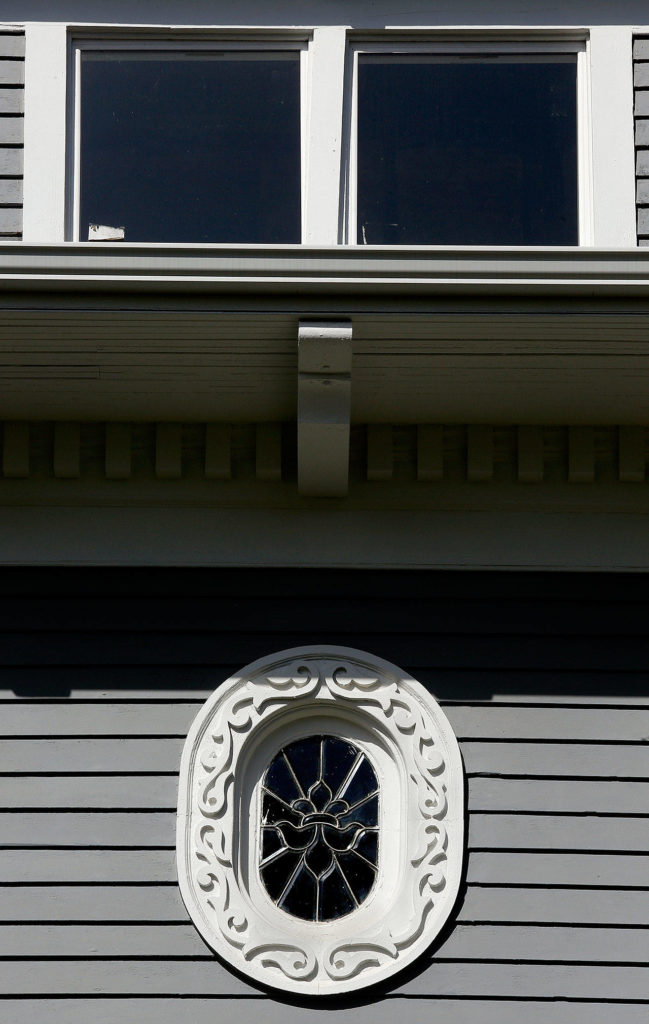 High on the house is the ornate framework around a leaded oval window in an upstairs bedroom closet. (Dan Bates / The Herald)
