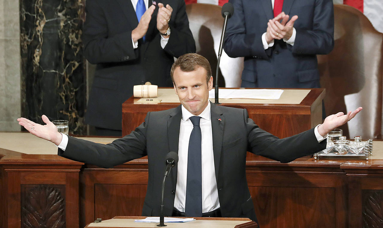 French President Emmanuel Macron gestures as he is introduced before speaking to a joint meeting of Congress on Capitol Hill in Washington on Wednesday.(AP Photo/Pablo Martinez Monsivais)