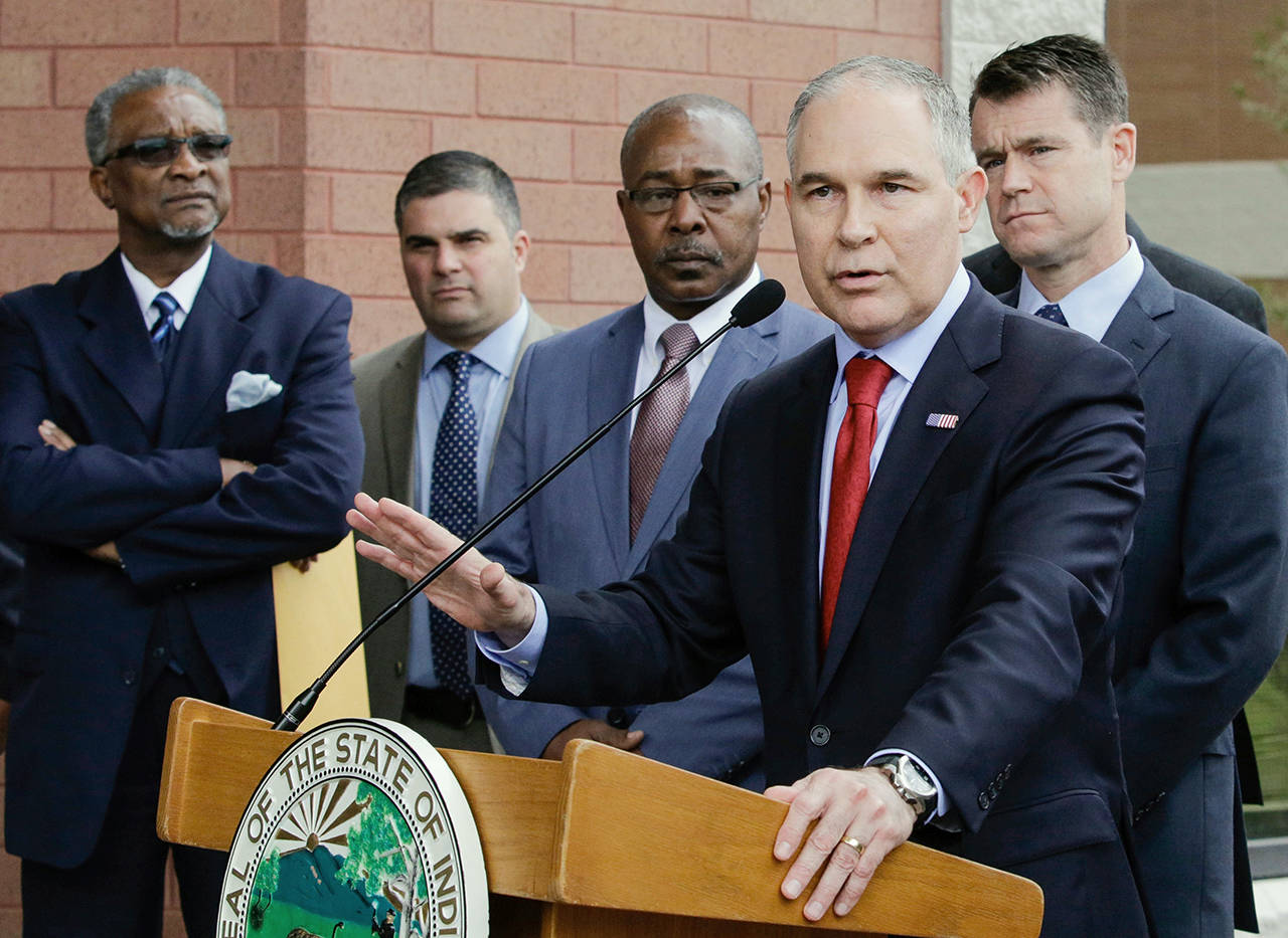 In this 2017 photo, Environmental Protection Agency Administrator Scott Pruitt speaks at a news conference with Pasquale “Nino” Perrotta, second from left, in East Chicago, Indiana. (AP Photo/Teresa Crawford, File)