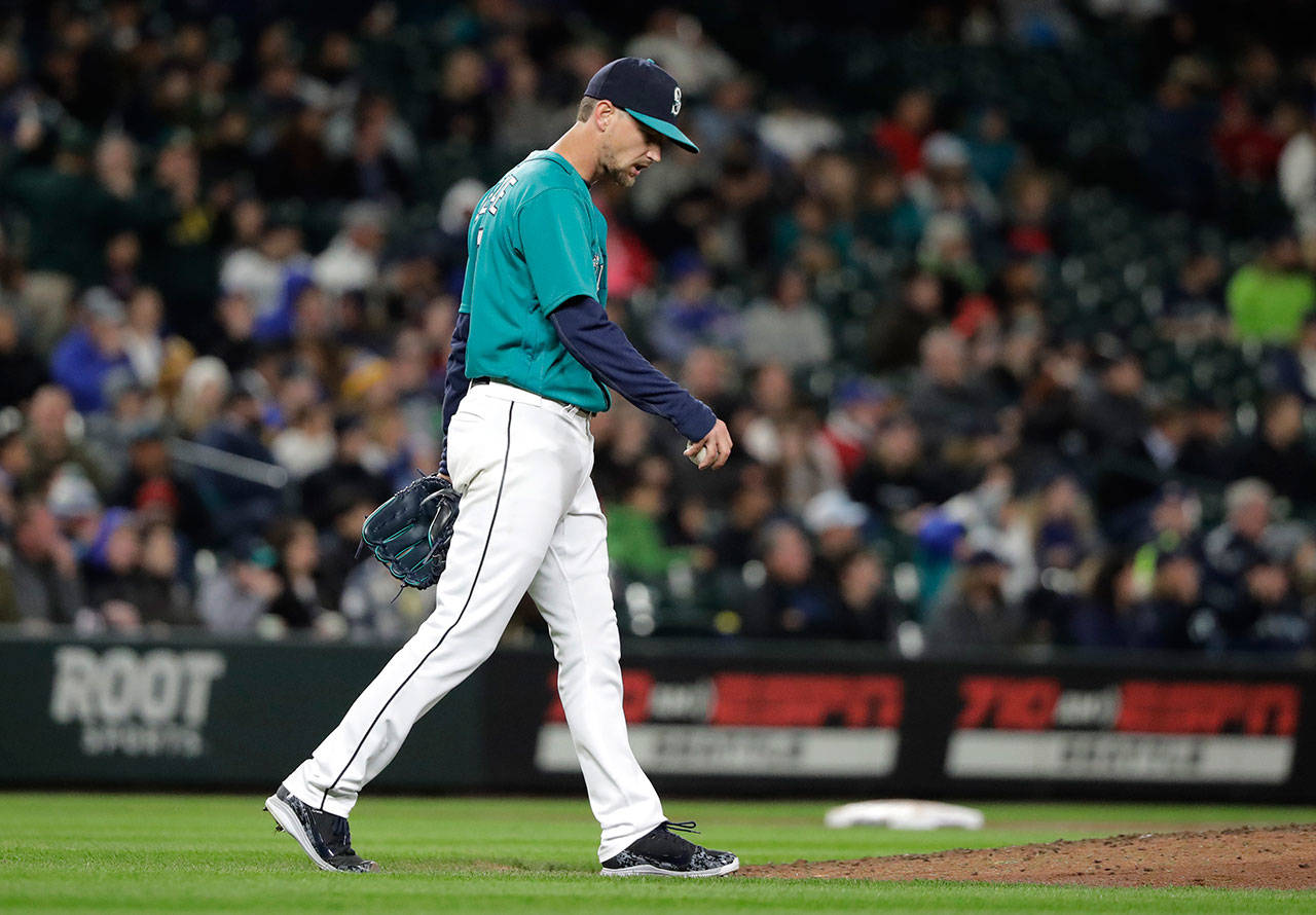 Seattle’s Mike Leake walks back to the mound after giving up a home run to Oakland’s Matt Chapman during the sixth inning of an April 13 game at Safeco Field. (AP Photo/Ted S. Warren)