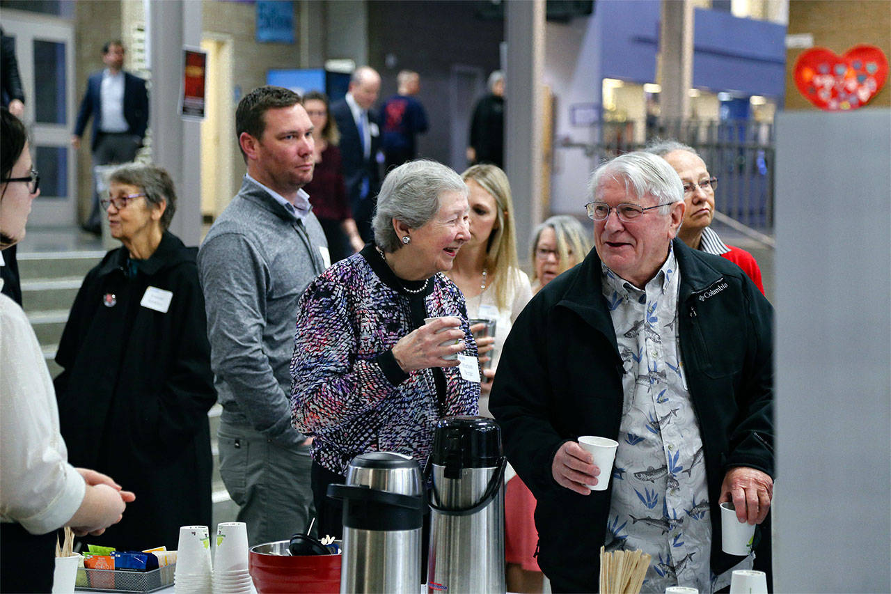 Marian Berge, co-founder of the Snohomish Education Foundation, chats with Rod Vroman, a Kiwanis Club of Snohomish board member, at the Snohomish Education Foundation Breakfast, held March 29 at Glacier Peak High School. (Contributed photo)