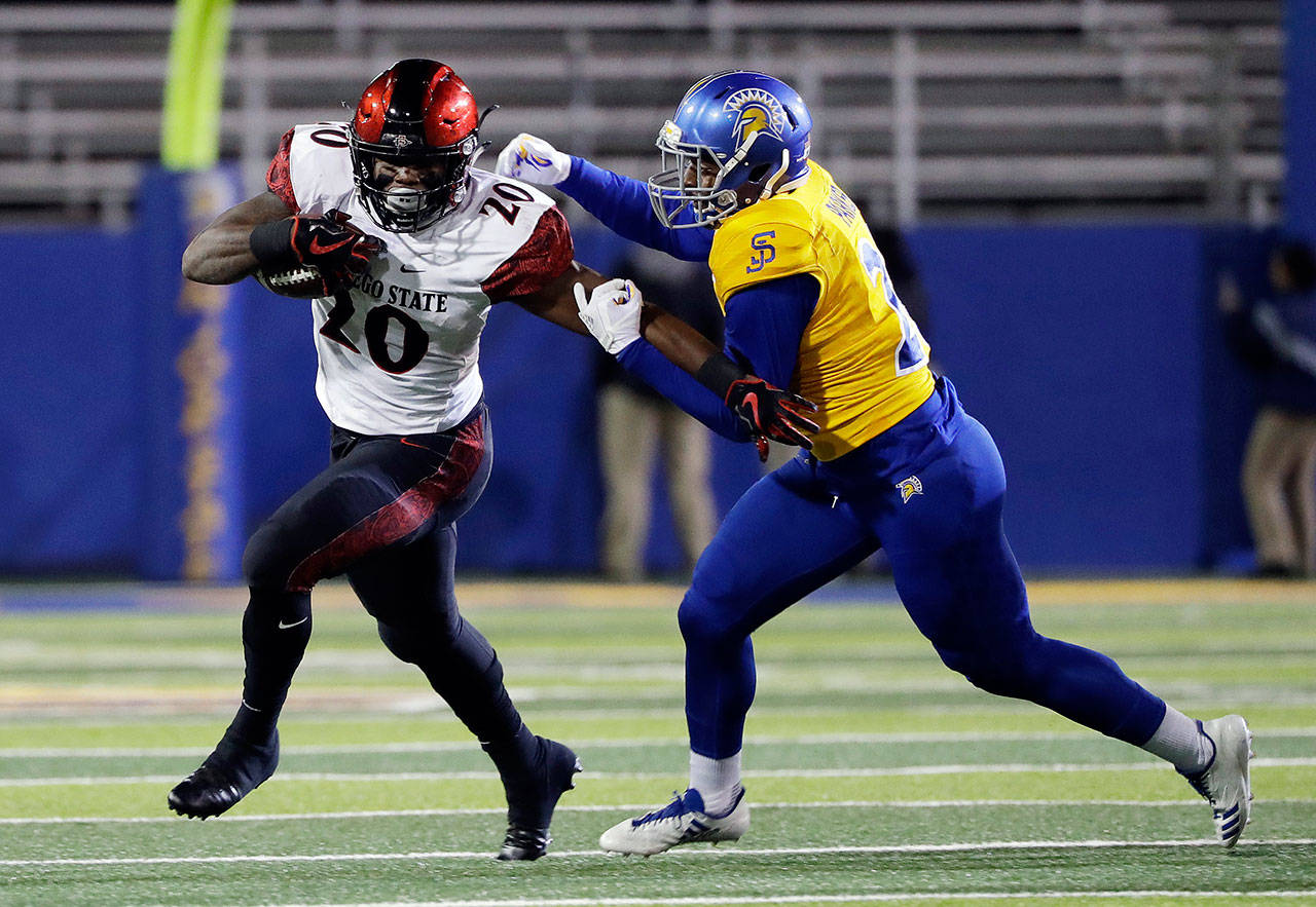 San Diego State running back Rashaad Penny (right) carries the ball during a game against San Jose State on Nov. 4, 2017, in San Jose, Calif. (AP Photo/Marcio Jose Sanchez)