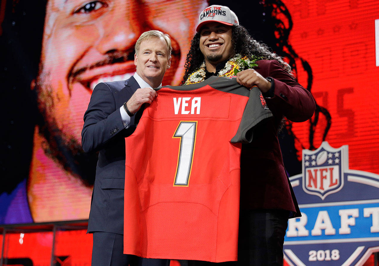 Washington’s Vita Vea (right) poses with commissioner Roger Goodell after being picked by the Buccaneers in the first round of the NFL draft on April 26, 2018, in Arlington, Texas. (AP Photo/David J. Phillip)