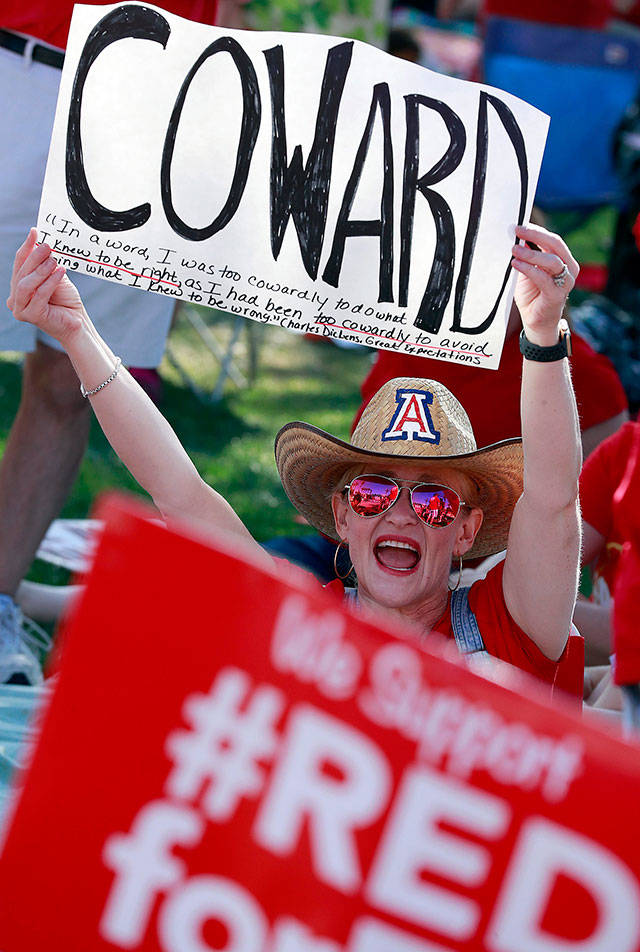 Scottsdale, Arizona, school teacher Sandy Flayton rallies outside the Capitol in Phoenix on Friday in a second day of school walkouts. (AP Photo/Matt York)