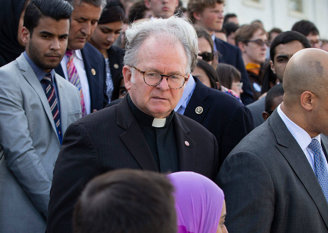 The Rev. Patrick Conroy, former chaplain of the House of Representatives, delivers an interfaith message June 13, 2016, on the steps of the Capitol in Washington, D.C., for the victims of the mass shooting at an LGBT nightclub in Orlando. Conroy, a Roman Catholic priest from the Jesuit order, has been forced out after seven years by House Speaker Paul Ryan after complaints by some lawmakers claimed he was too political. (J. Scott Applewhite / Associated Press file)