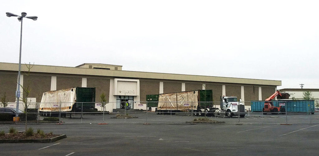 Construction workers were on site Friday for a redevelopment of the old Everett Macy’s. (Rikki King / The Herald)
