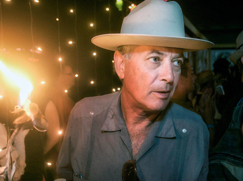 This 2011 photo shows Larry Harvey, co-founder of the Burning Man festival, during a party at Media Mecca, the communications center, during the festival in the Black Rock Desert in Nevada. (John Curley via AP)
