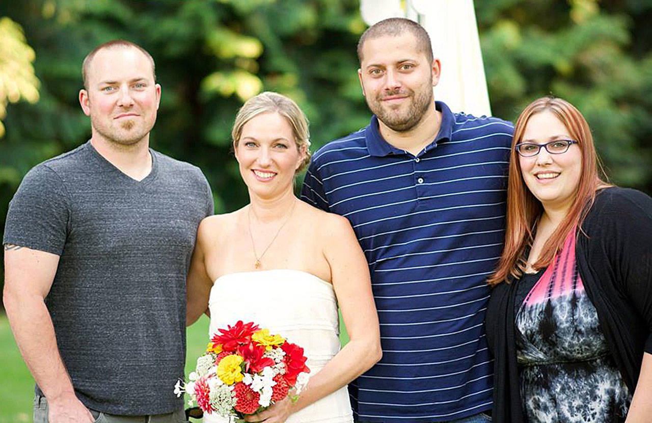 Alex Dold (second from the right) is joined by his three older siblings, Mike Dold (left). Jen Dold (second from the left) and Vanessa Dold, for a backyard wedding in Woodway.