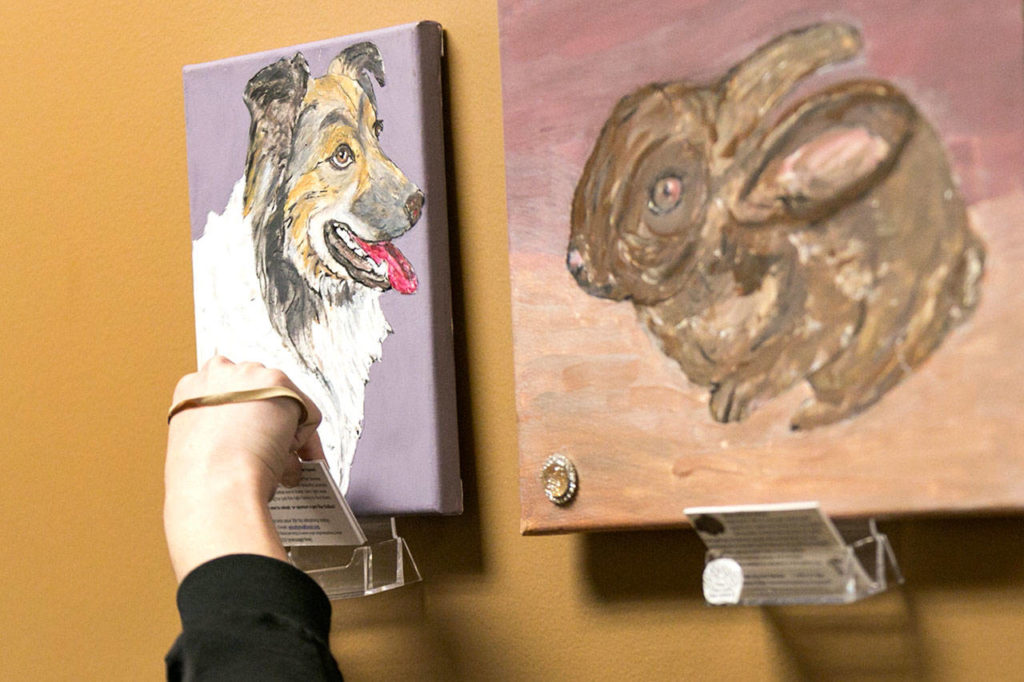 Identification cards go with each Paws With Cause portrait at Fred Meyer in Snohomish.
(Kevin Clark / The Herald)
