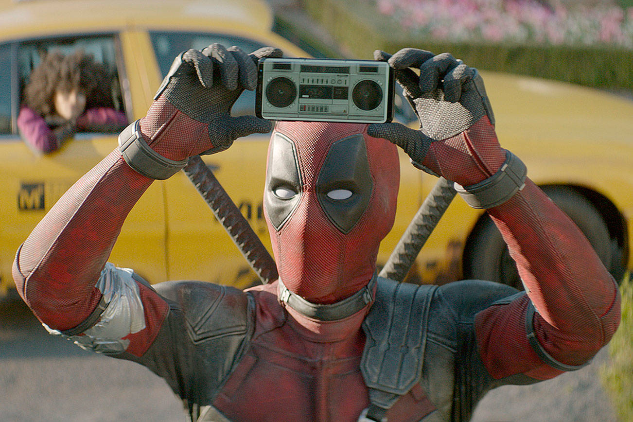 Ryan Reynolds’ smart-mouthed superhero mimics the famous “Say Anything” scene in “Deadpool 2,” one of the summer’s most anticipated movies. (Twentieth Century Fox)