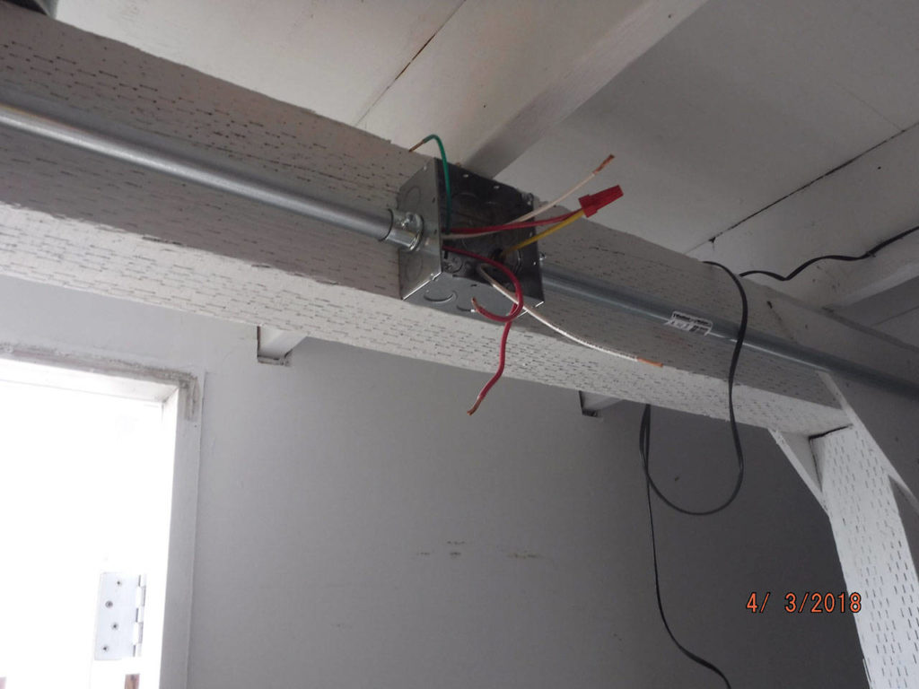An open electrical box and with uncapped wires. (City of Everett)
