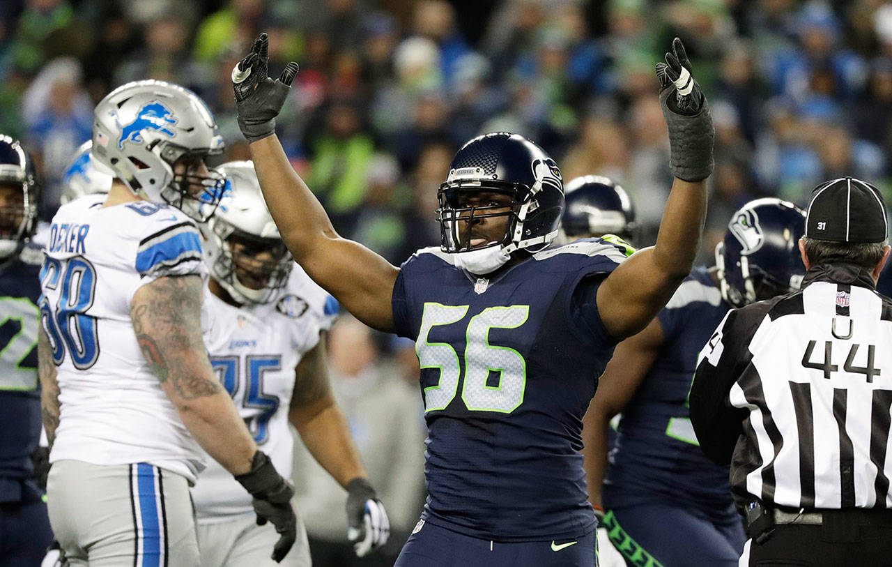 Former Seattle Seahawks defensive end Cliff Avril reacts to a play against the Detroit Lions in the second half of an NFL playoff game, Jan. 7, 2017, in Seattle. (Elaine Thompson / Associated Press)