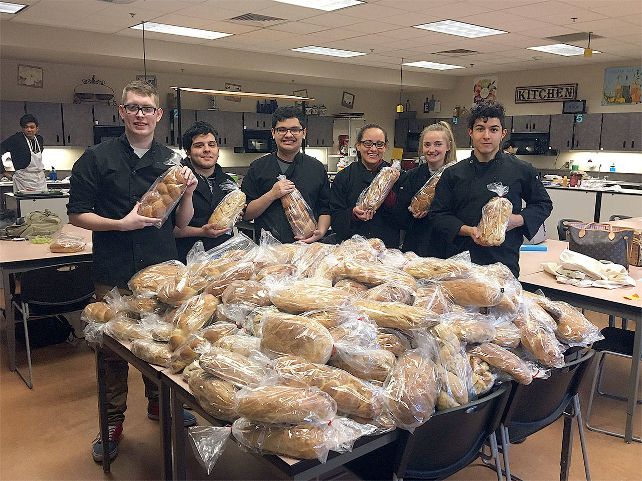 Meadowdale High School culinary arts students (from left) Andrew Erban, Mario Gonzalez, Jaimz Guzman, Nasmil Valera Cuevas, Kelci Studioso and Antonio Samayoa display some of the results of their participation in the “Bake for Good: Kids” program. (Contributed photo)