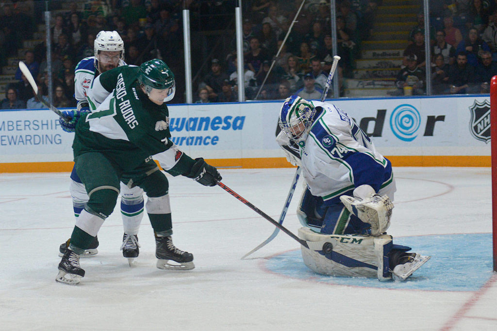 The Silvertips’ Martin Fasko-Rudas (left) takes a shot as Swift Current goalie Stuart Skinner (right) defends the net during Game 1 of the WHL finals on May 4, 2018, in Swift Current, Saskatchewan. (Steven Mah / Southwest Booster)
