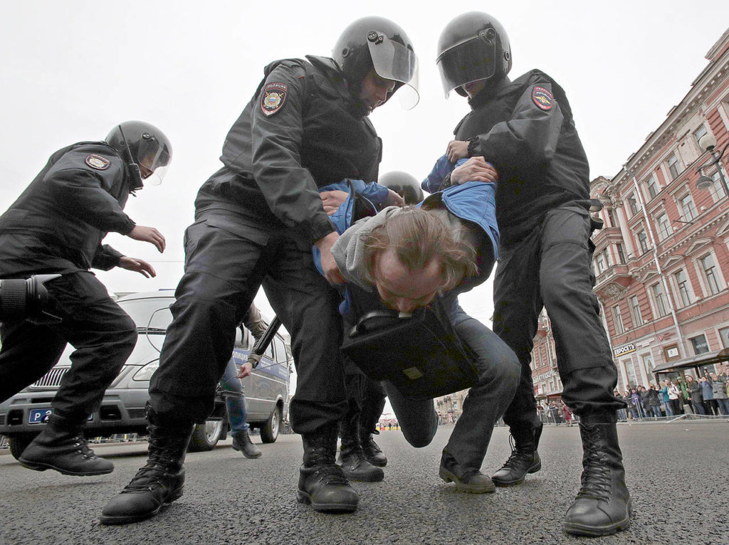 Russian police detain a protester at a demonstration against President Vladimir Putin in St.Petersburg, Russia, on Saturday. (AP Photo/Dmitri Lovetsky) 
