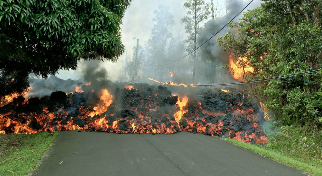 A lava flow moves across Makamae Street in the Leilani Estates subdivision near Pahoa on the island of Hawaii. (U.S. Geological Survey via AP)

