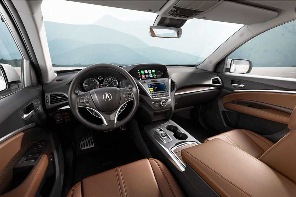 Quickened response time and support for Android Auto and Apple CarPlay are upgrades to the 2018 Acura MDX infotainment system. The Advance model’s interior is shown here. 
