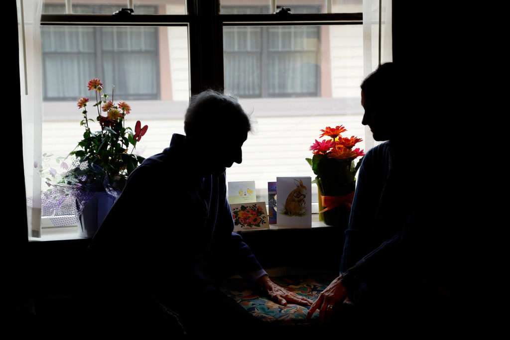 Julie Muhlstein and her mother talk about family during a recent visit in Spokane. (Dan Bates / The Herald)
