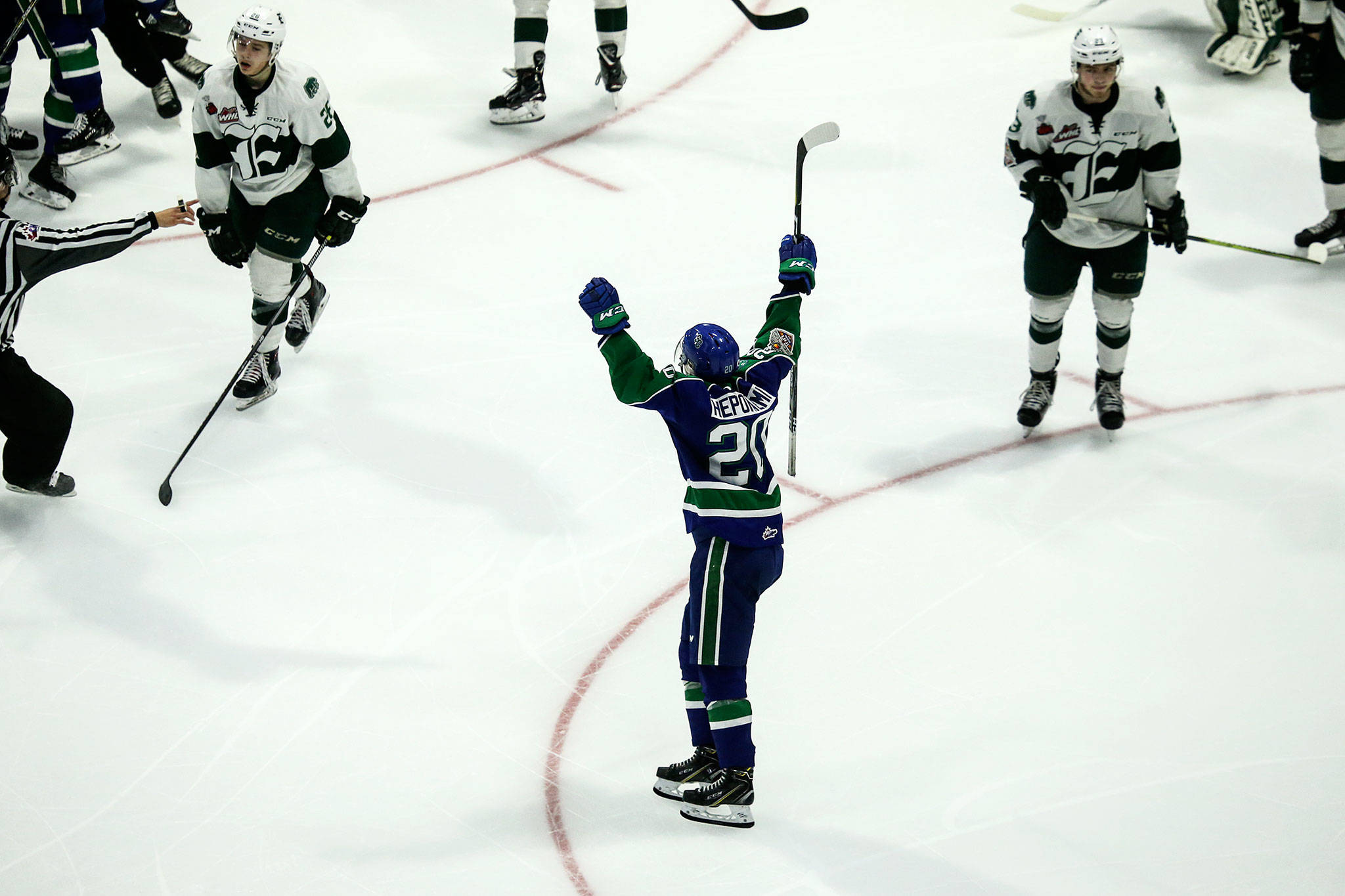 Swift Current’s Aleksi Heponiemi (center) celebrates an overtime goal by Glenn Gawdin (not pictured) to give the Broncos a 3-2 victory over the Silvertips in Game 3 of the WHL finals on May 8, 2018, at Angel of the Winds Arena in Everett. (Andy Bronson / The Herald)