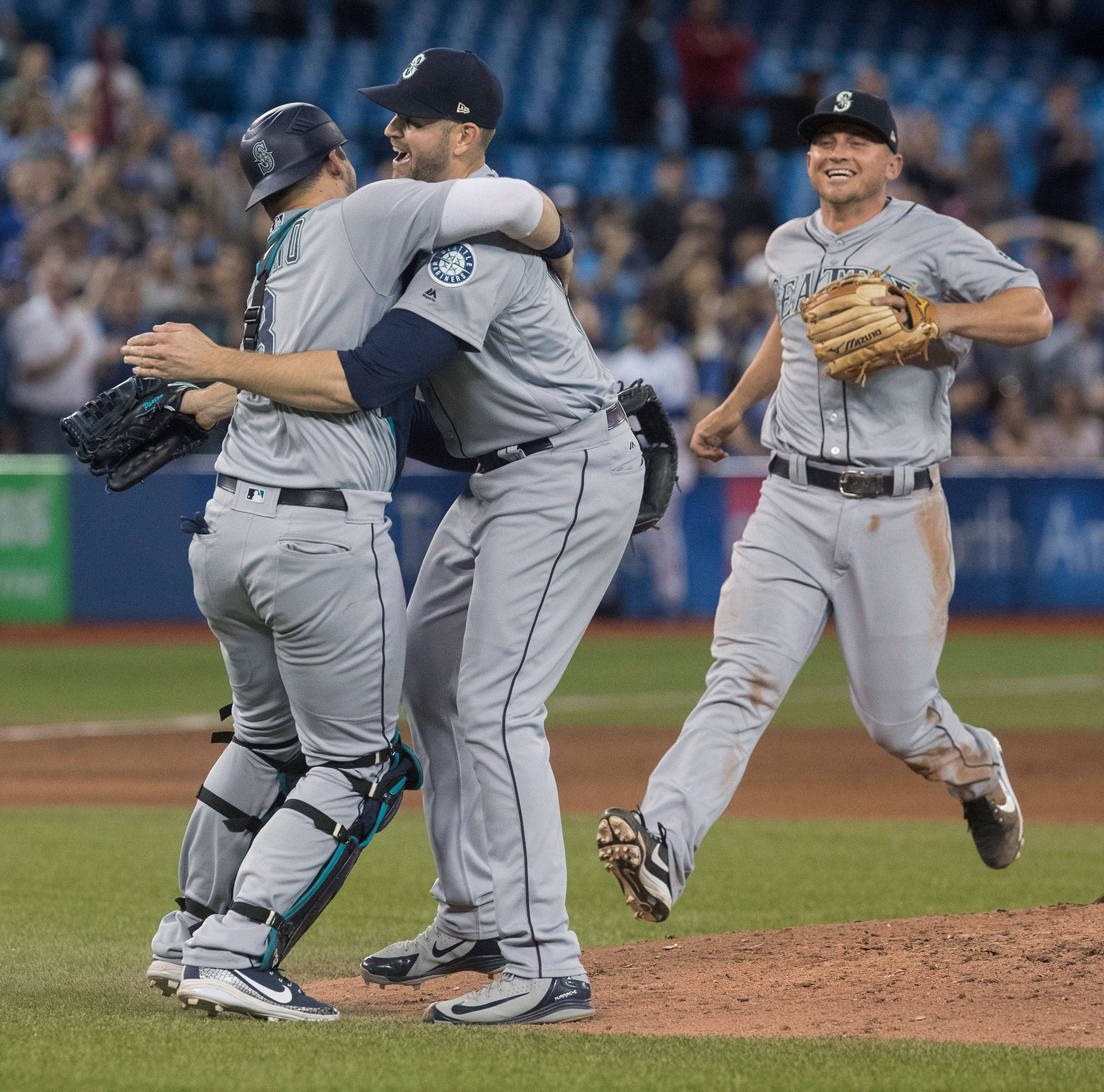 Mariners starting pitcher James Paxton (center) celebrates with teammates after throwing a no-hitter against the Blue Jays on May 8, 2018, in Toronto. (Fred Thornhill/The Canadian Press via AP)