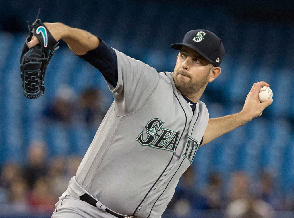 Mariners starting pitcher James Paxton throws to a Blue Jays batter during the first inning of a game May 8, 2018, in Toronto. (Fred Thornhill/The Canadian Press via AP)
