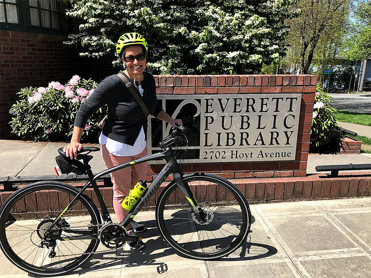 Everett Mayor Cassie Franklin cycled to the Everett Public Library to knock off the first required destination in a month-long Bike Month Challenge with Mukilteo Mayor Jennifer Gregerson. (City of Everett photo)